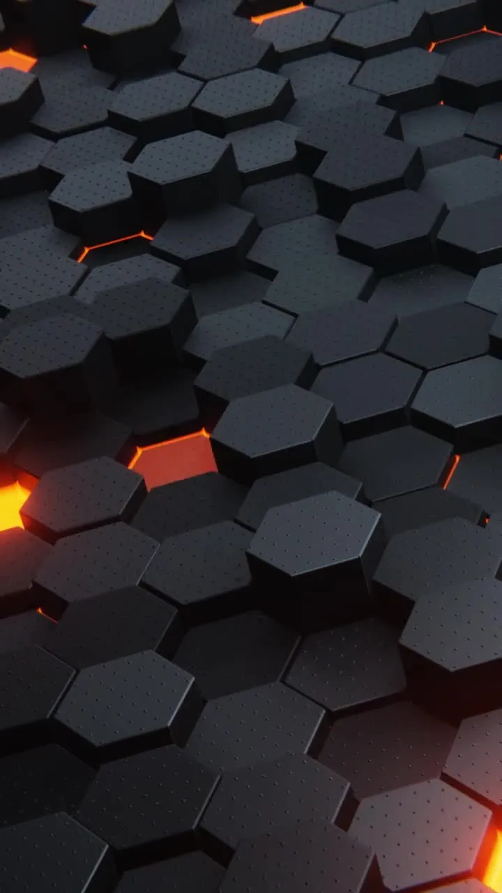 Абстрактная 3D-композиция из множества черных шестиугольных блоков с текстурой мелких точек, между которыми пробивается яркий оранжевый свет.